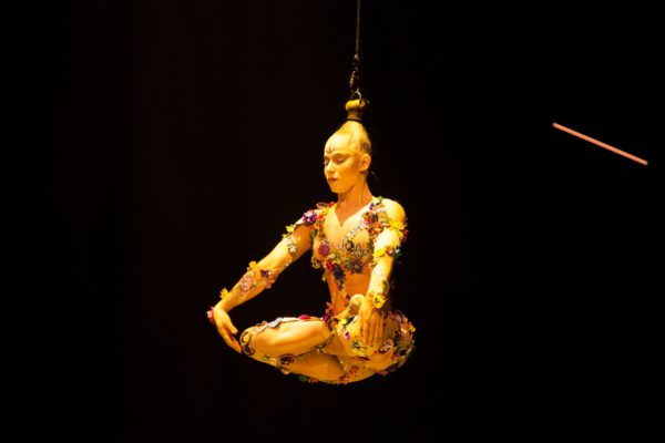 A performer levitated by her hair. Photo by Matt Beard. 