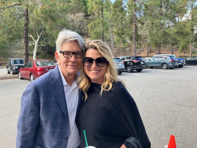 Nicole Mendez (R) with actor Eric Roberts on the set of "The Christmas Chain." 