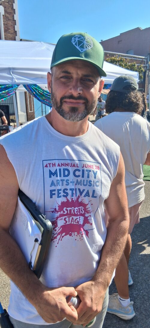 Cover and Inside Photo: Nick Spano, who spearheaded the Mid City Arts and Music Festival. 