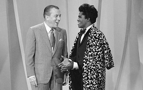 Cover Photo: Ed Sullivan. Inside photo-Ed Sullivan and James Brown. Photos- Getty Images. 